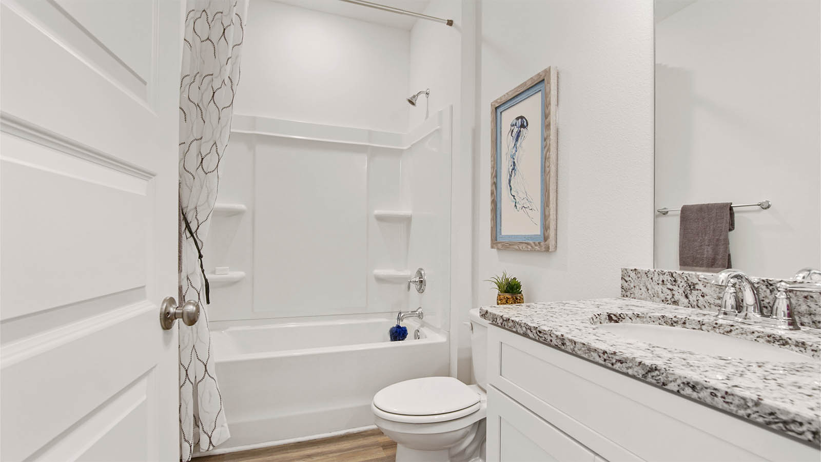 Full bathroom two with single vanity and tub shower combination.