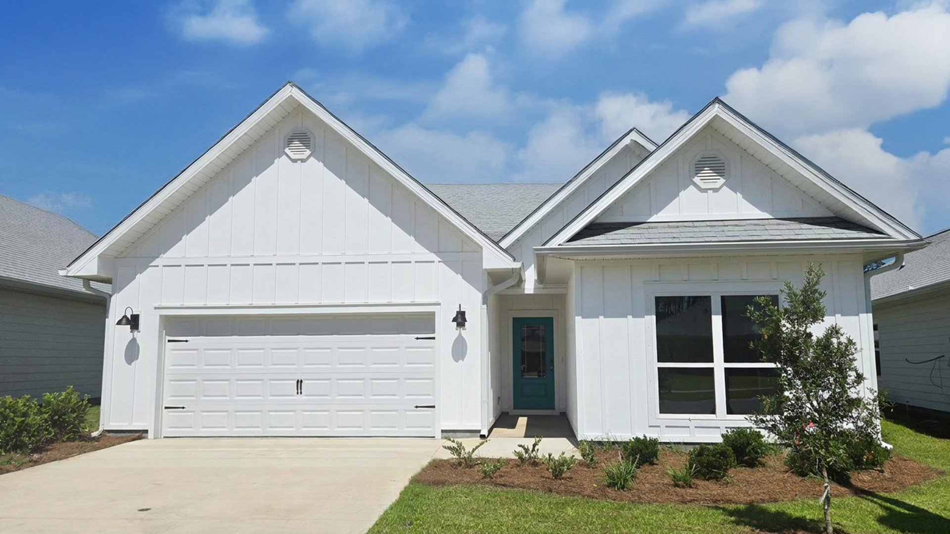 360 Bartlett Cove is a preconstruction homesite to be built with the Kennedy floor plan. This image shows a similar Kennedy with white Hardie exterior and a two car garage and covered front entry