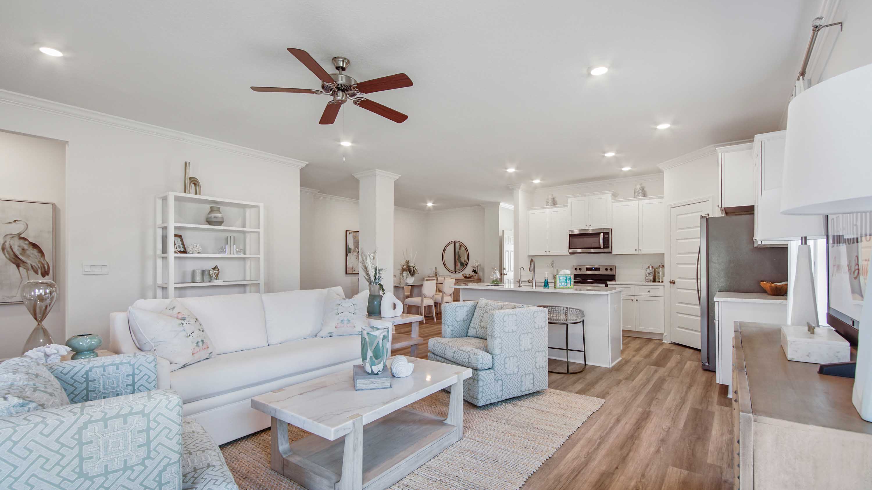 Kitchen with corner walk in pantry with EVP flooring.