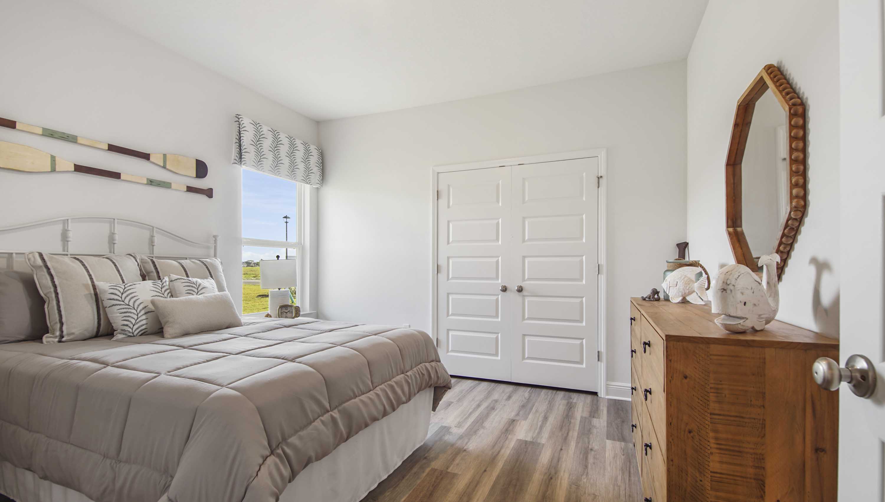 Bedroom four with EVP and window and closet.