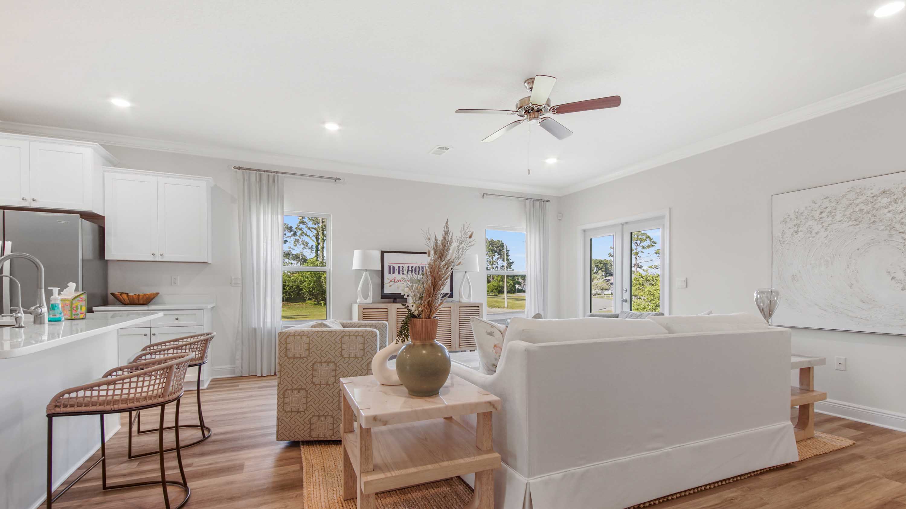 Dining area with EVP flooring next to storage closet.