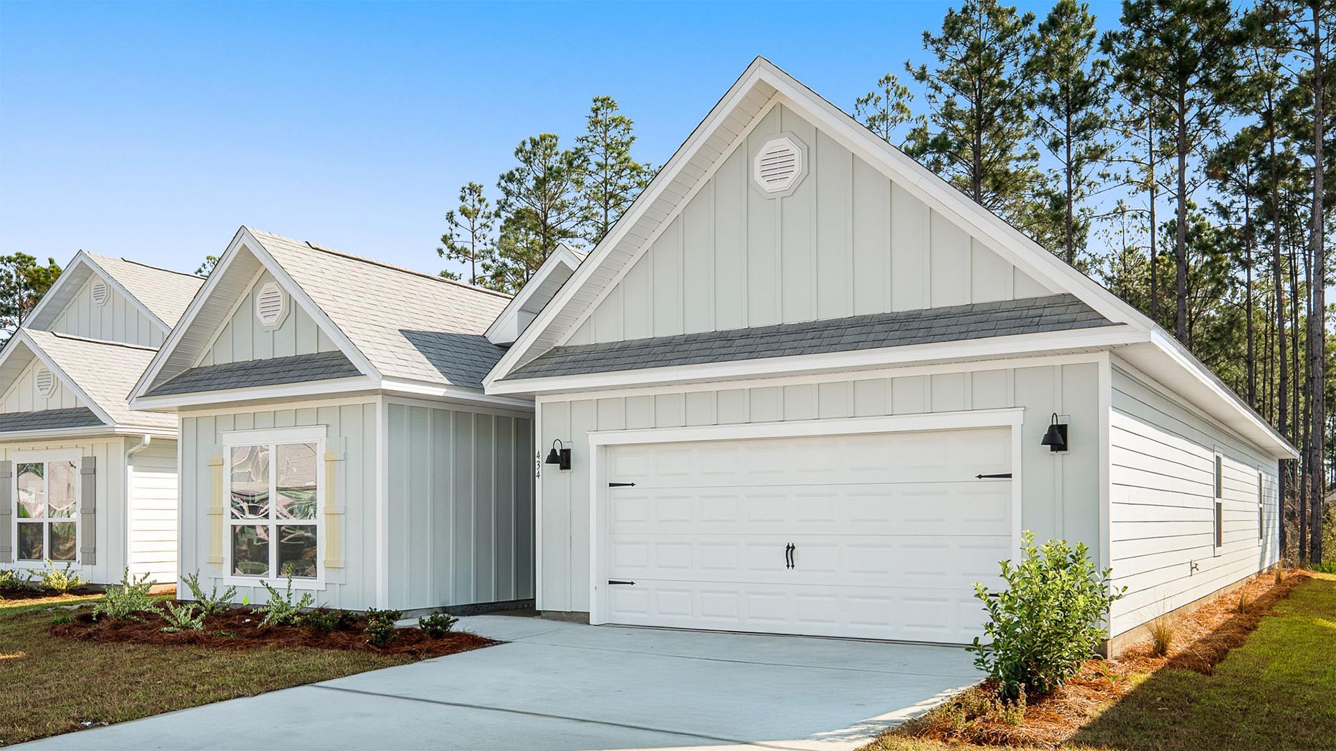 This home has a two car garage with remote entry and a covered front entryway