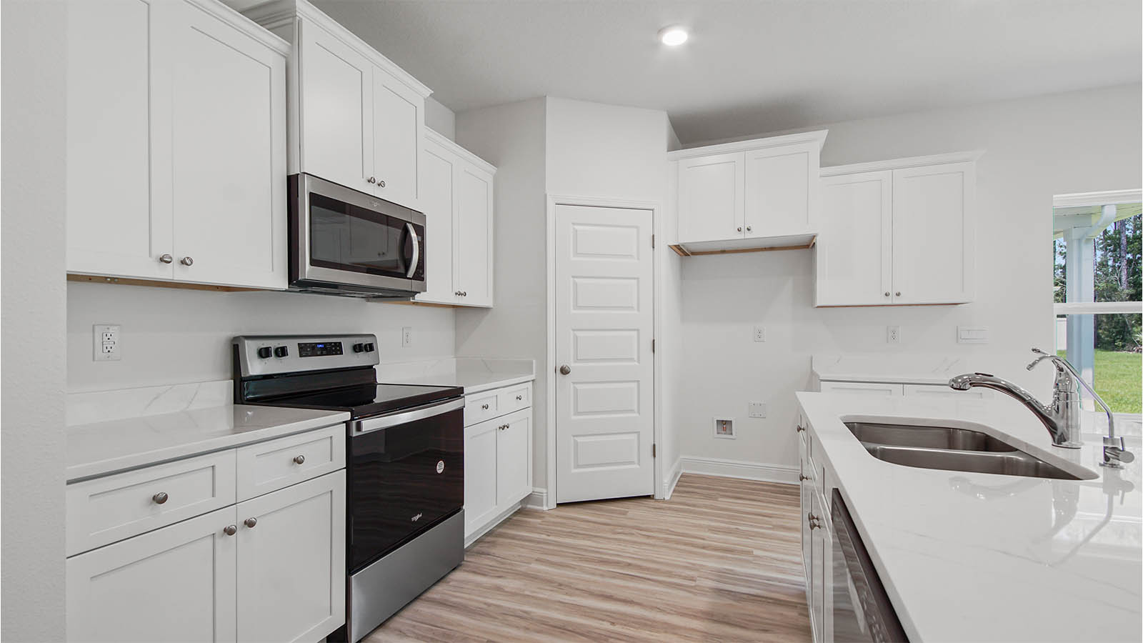 The kitchen has a corner pantry