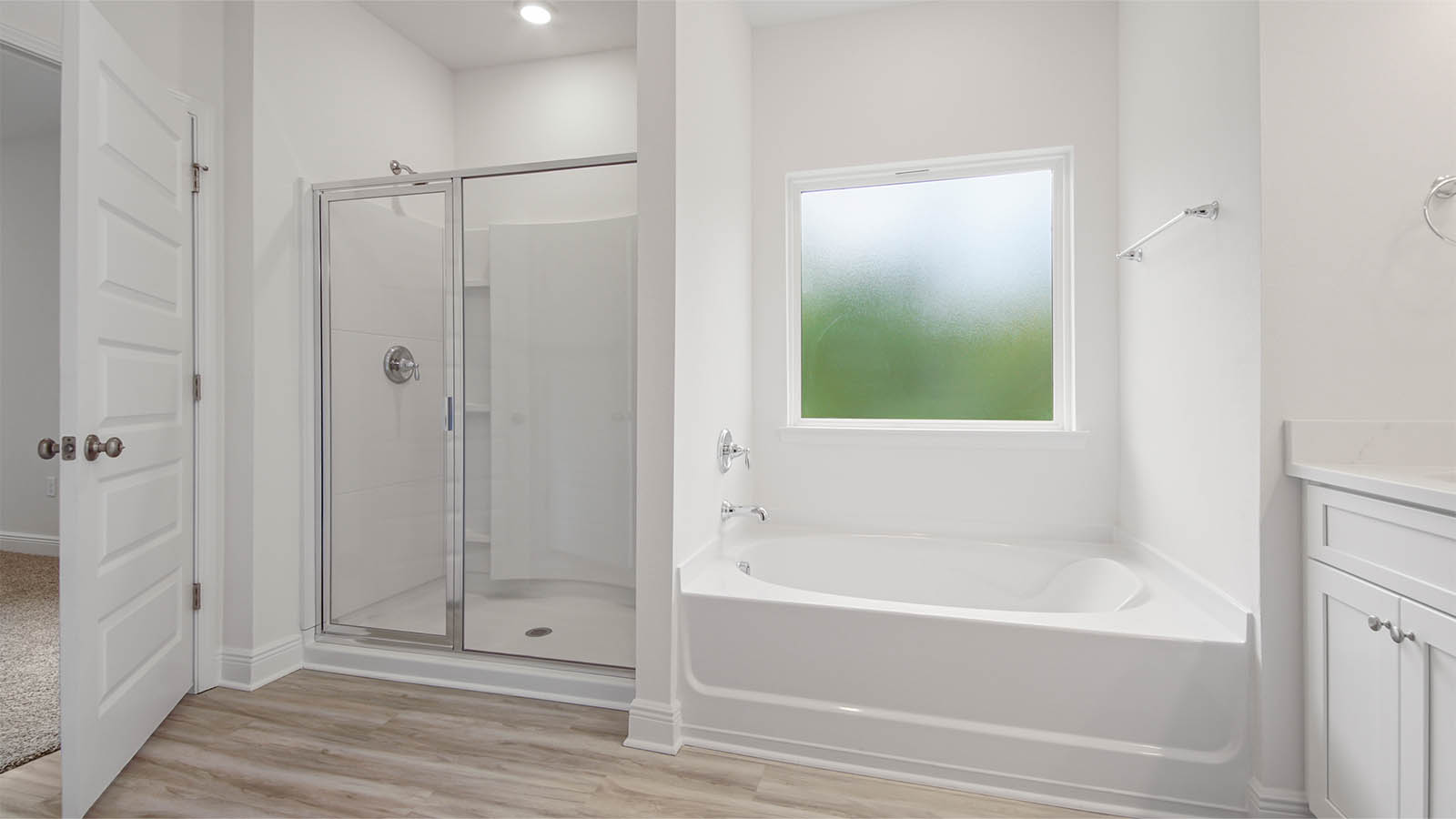 The primary bathroom has a separate shower and soak tub
