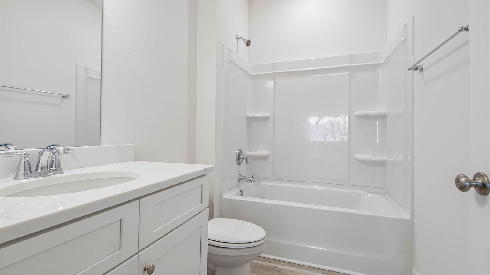 The shared bathroom has a shower tub combination