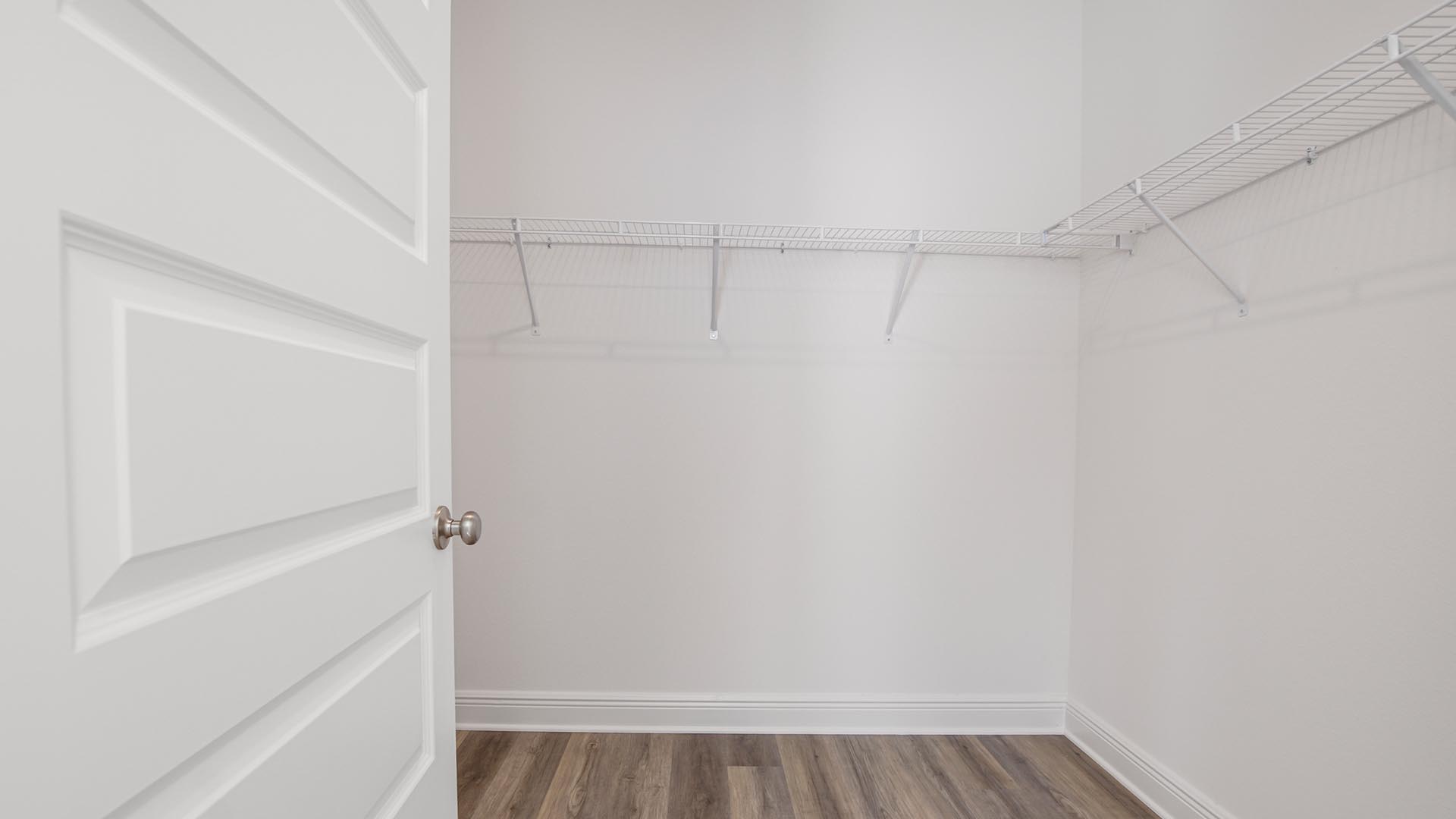 Primary closet with ventilated shelving