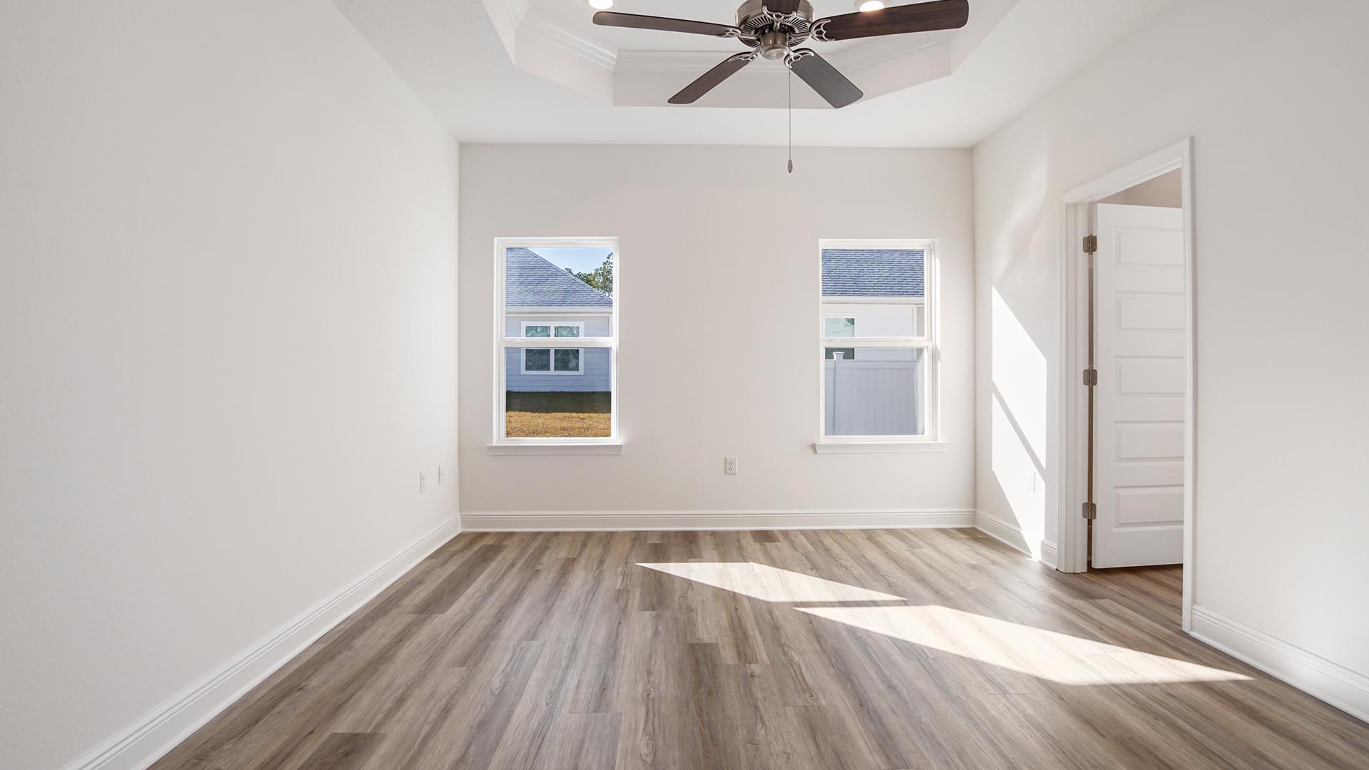 The primary bedroom of the Oakley floor plan