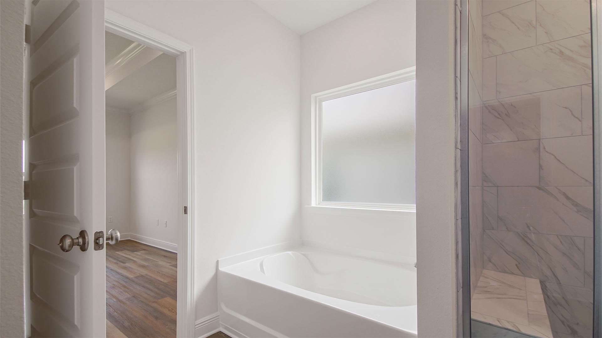 There is a separate shower and soak tub