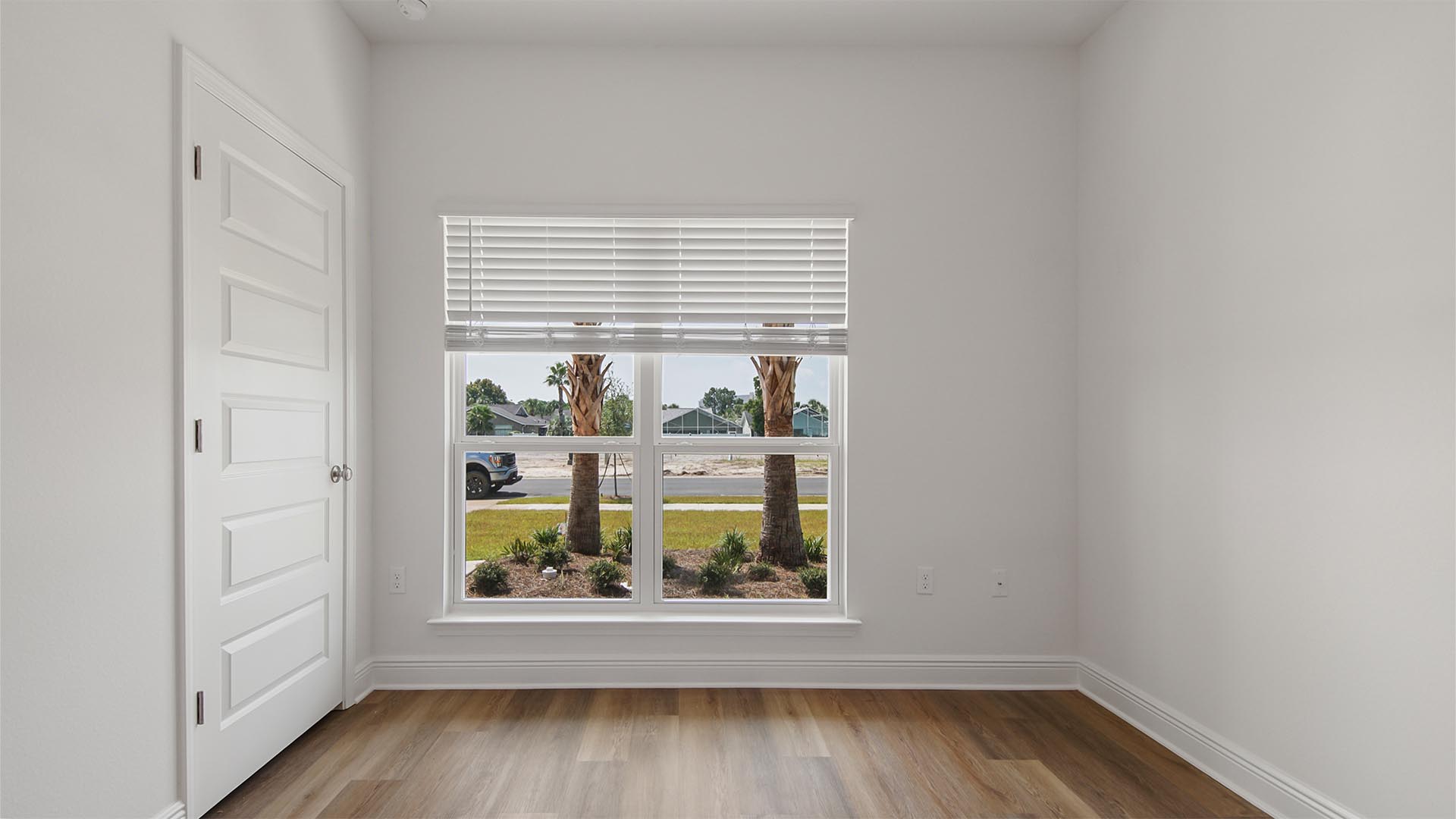 Bedroom two is illuminated with natural light by the picture window