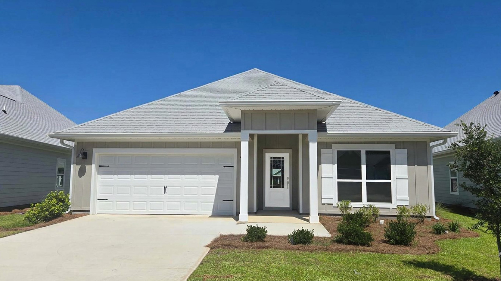 562 Hancock Way is under construction. This home has Hardie exterior with a covered entry and two car garage. Image shows a similar Rhett at completion