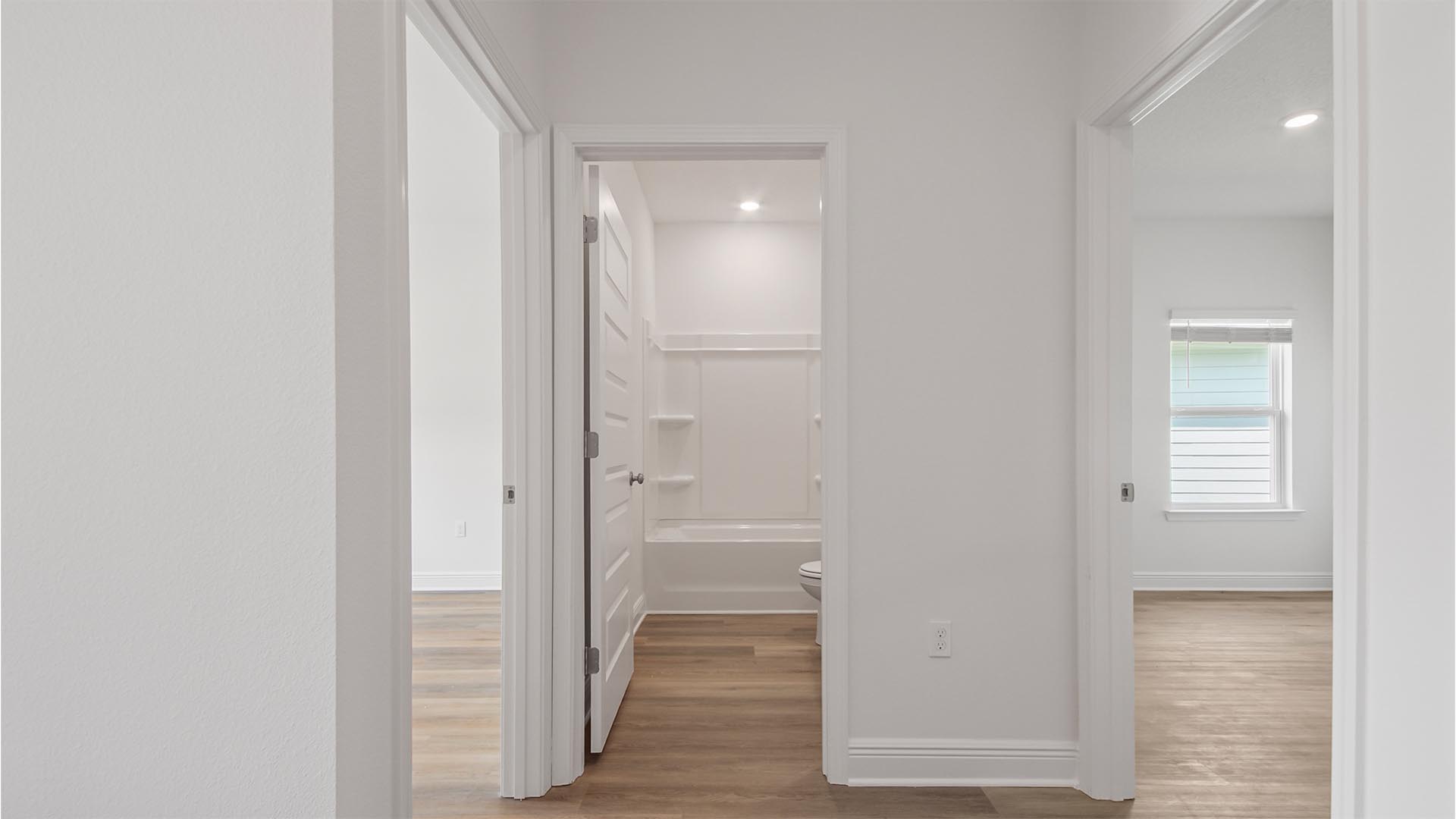 Bedrooms two and three are split by the shared bathroom