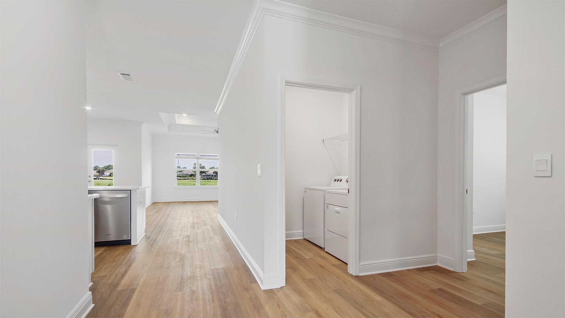 There is a second hall leading to bedroom four the garage and laundry room