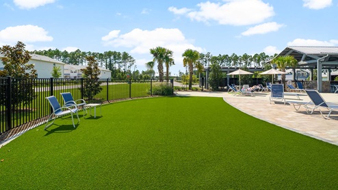 There is a green space by the pool for you to bring your cornhole boards or othe lawn games