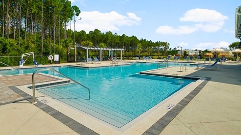 Beautiful pool with ample lounge areas and seating