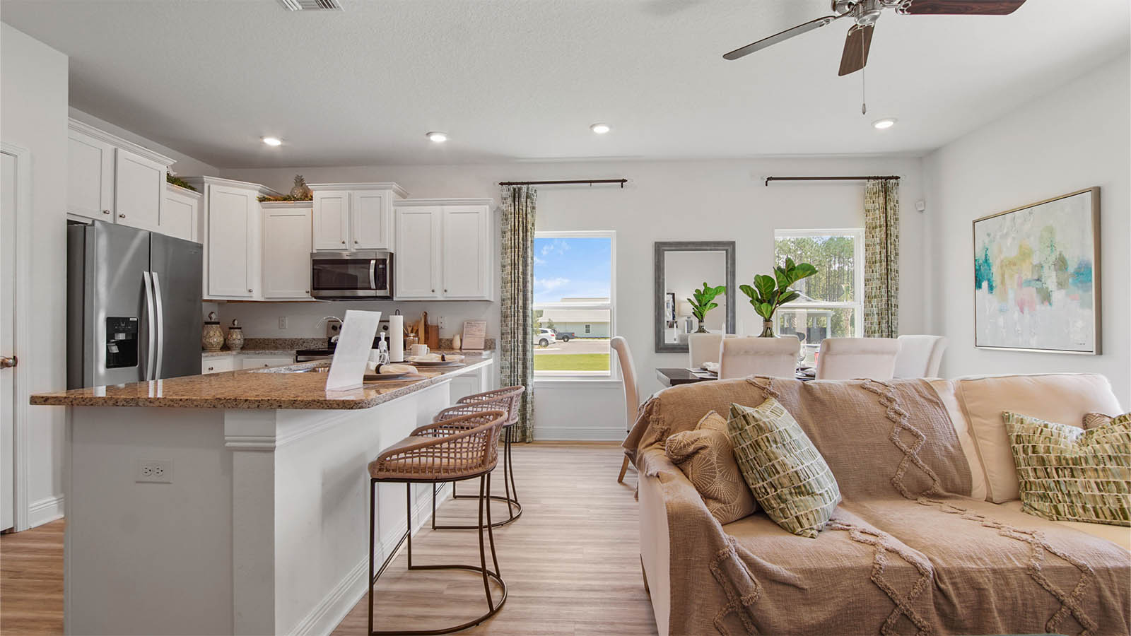 Kitchen and living area are open and have EVP flooring