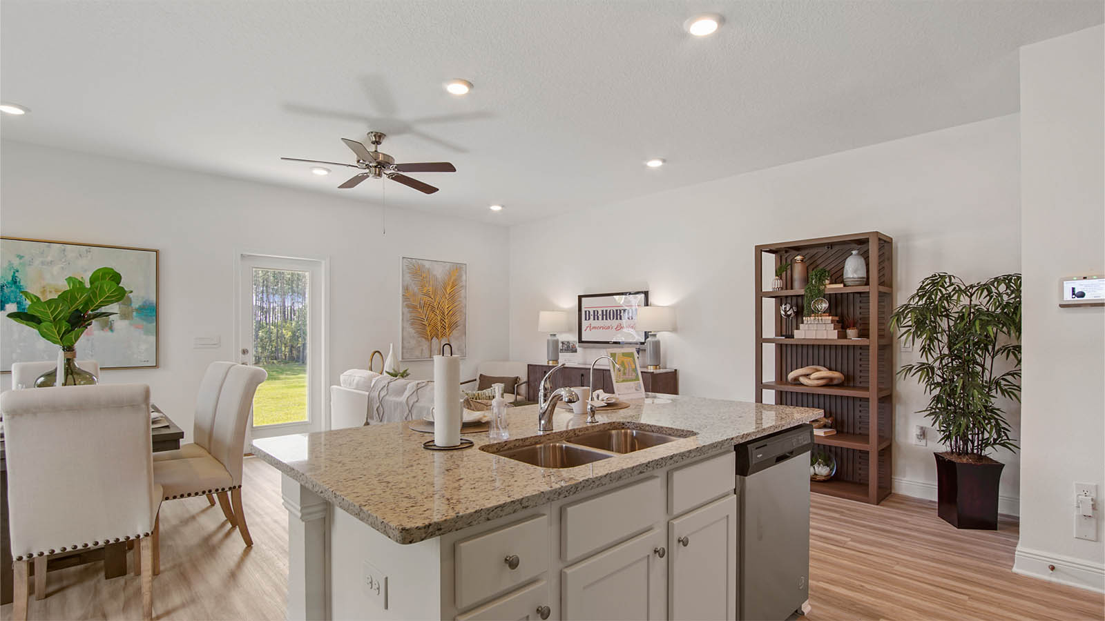 Open and spacious kitchen looks out to the living and dining area