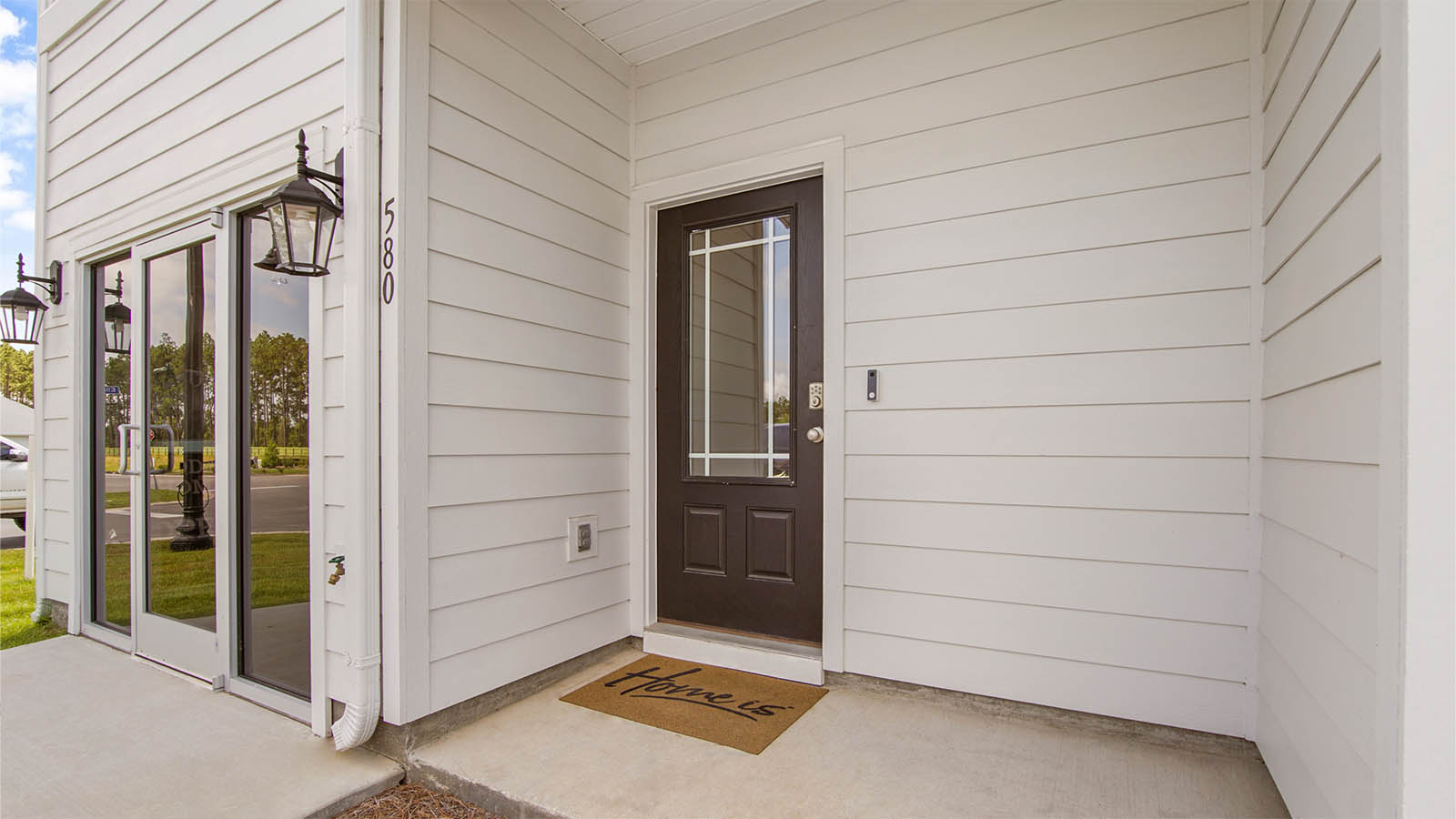 Entry to the townhome has a prairie style entry door.