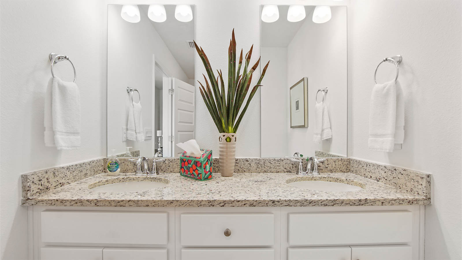 Primary bathroom with vanity featuring dual sinks
