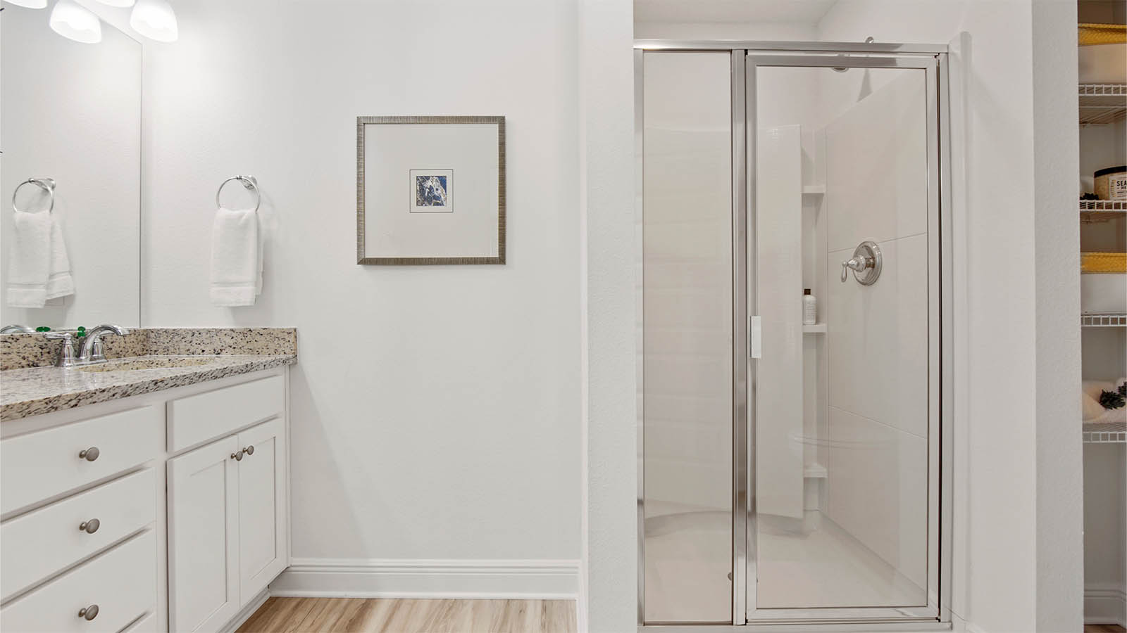 Primary bathroom with shower and dual sink vanity
