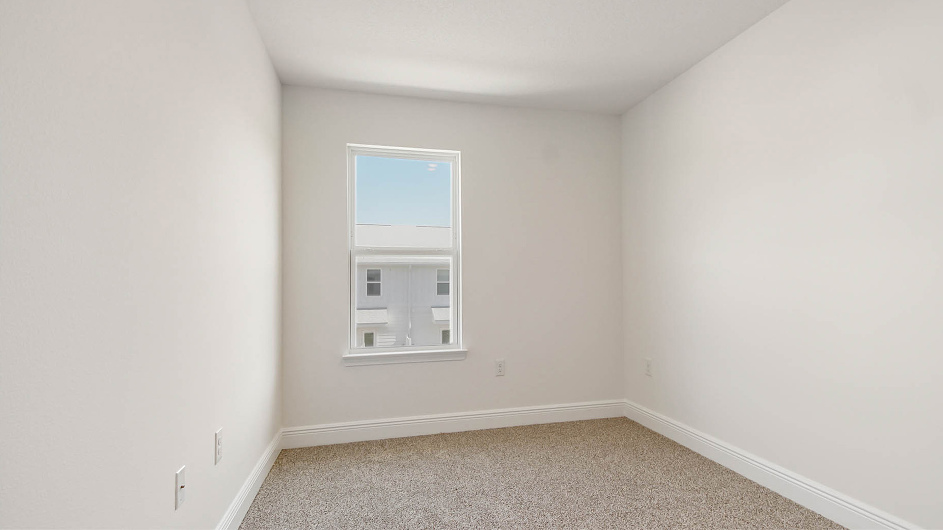 Bedroom 2 with closet space and plush carpet