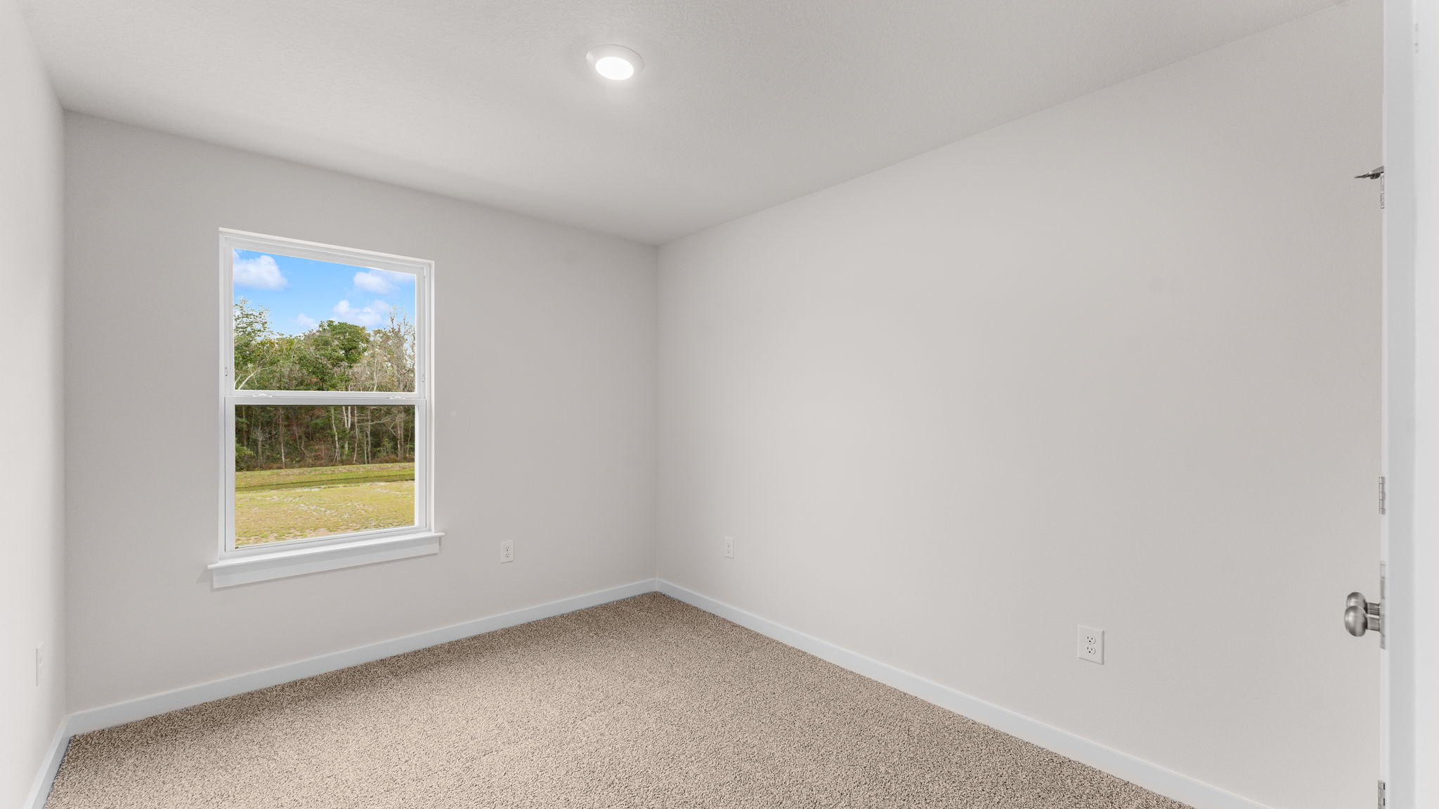 The guest bedrooms are at the back of the townhome