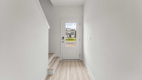 EVP floors throughout the main level and prairie door with glass entry