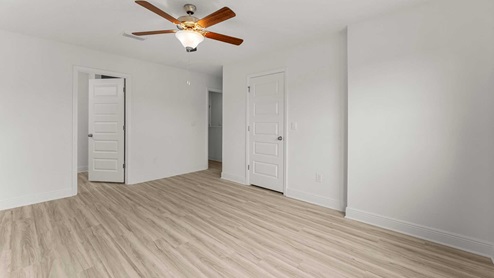 The primary bedroom is on the second level and has EVP floor