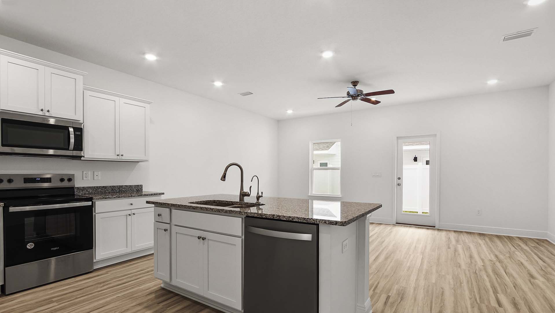 The open living area serves as the heart of this townhome