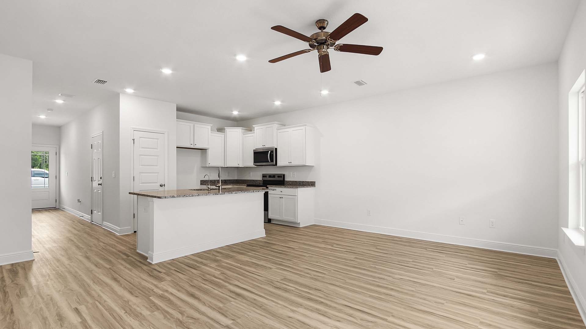 The living area is illuminated by windows