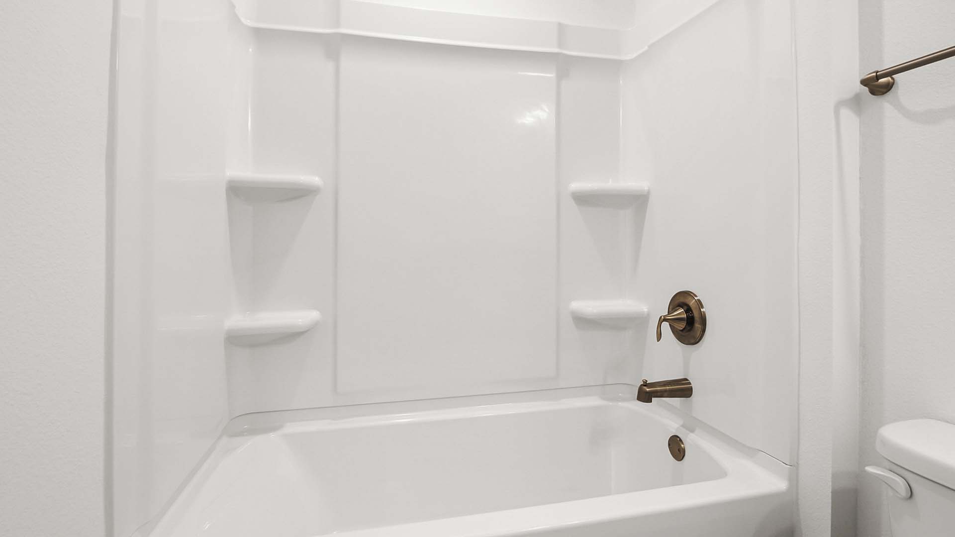 The shared bath has shower tub combination