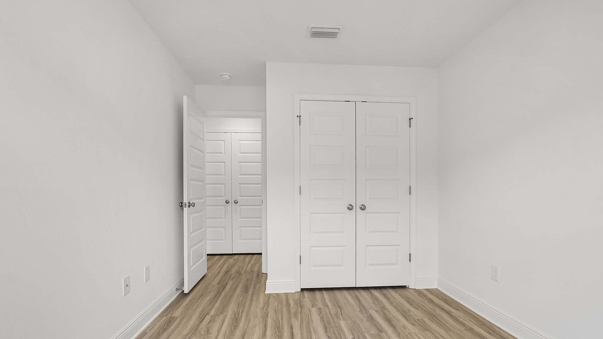 Guest bedroom two has EVP flooring