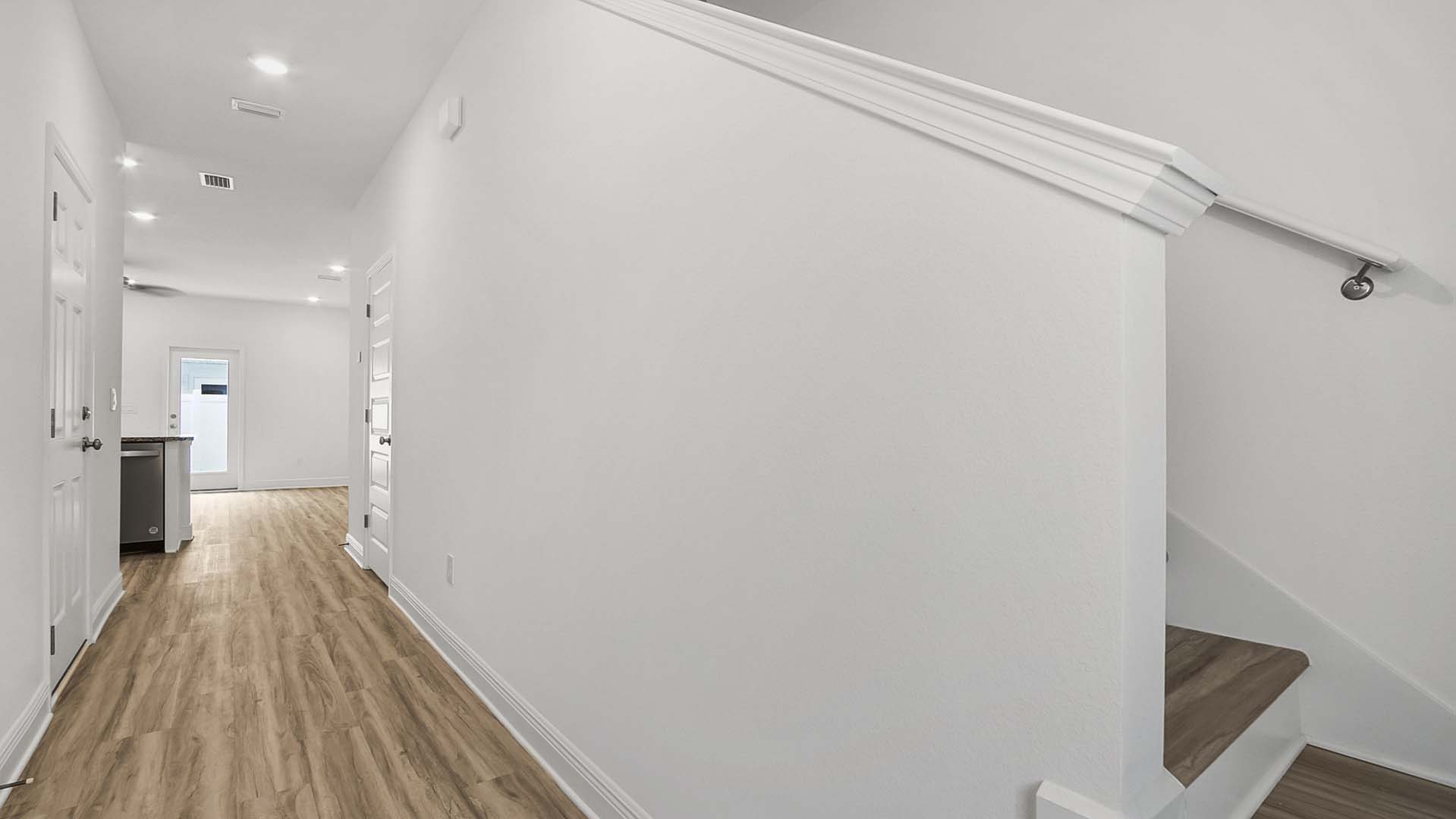 Entry hall leading to the living area with EVP flooring