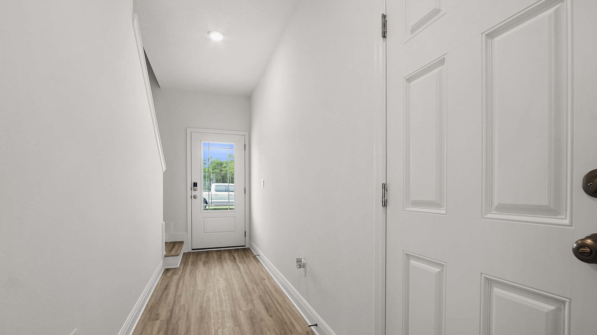 Garage access and a half bath are the entry hall