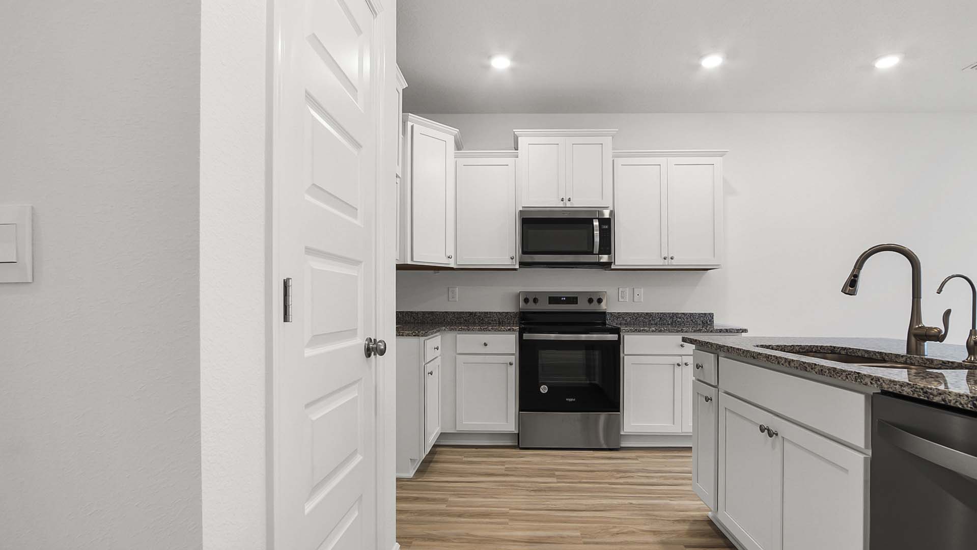 The kitchen opens to the living area