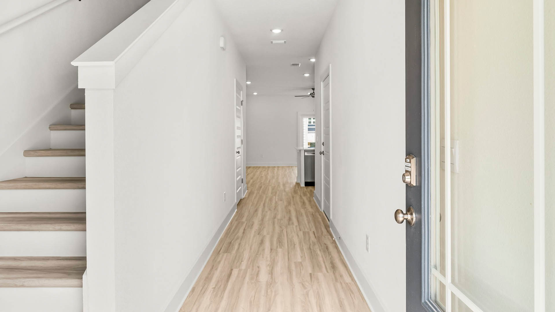 Entry hall of the Palm townhome with EVP flooring leading to the open living area