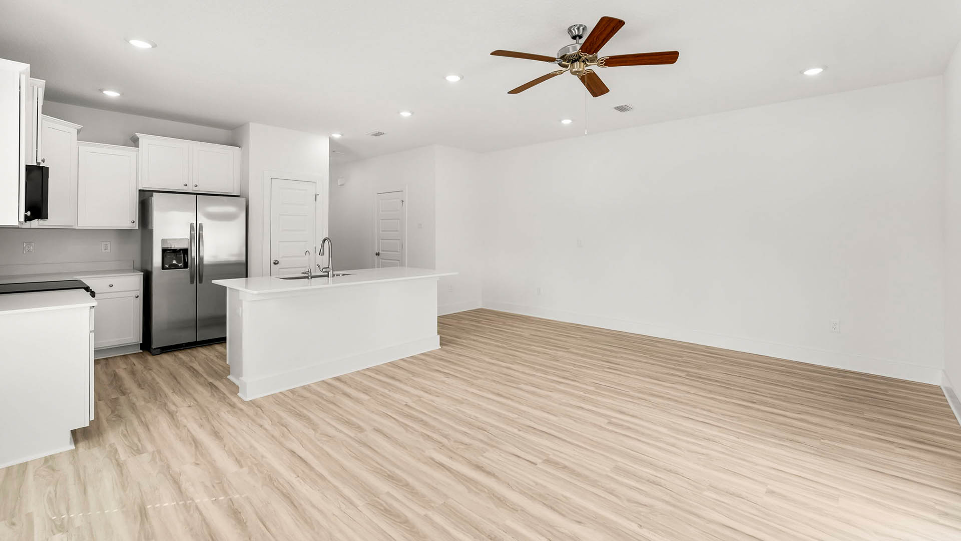 The kitchen is open to the living and dining areas