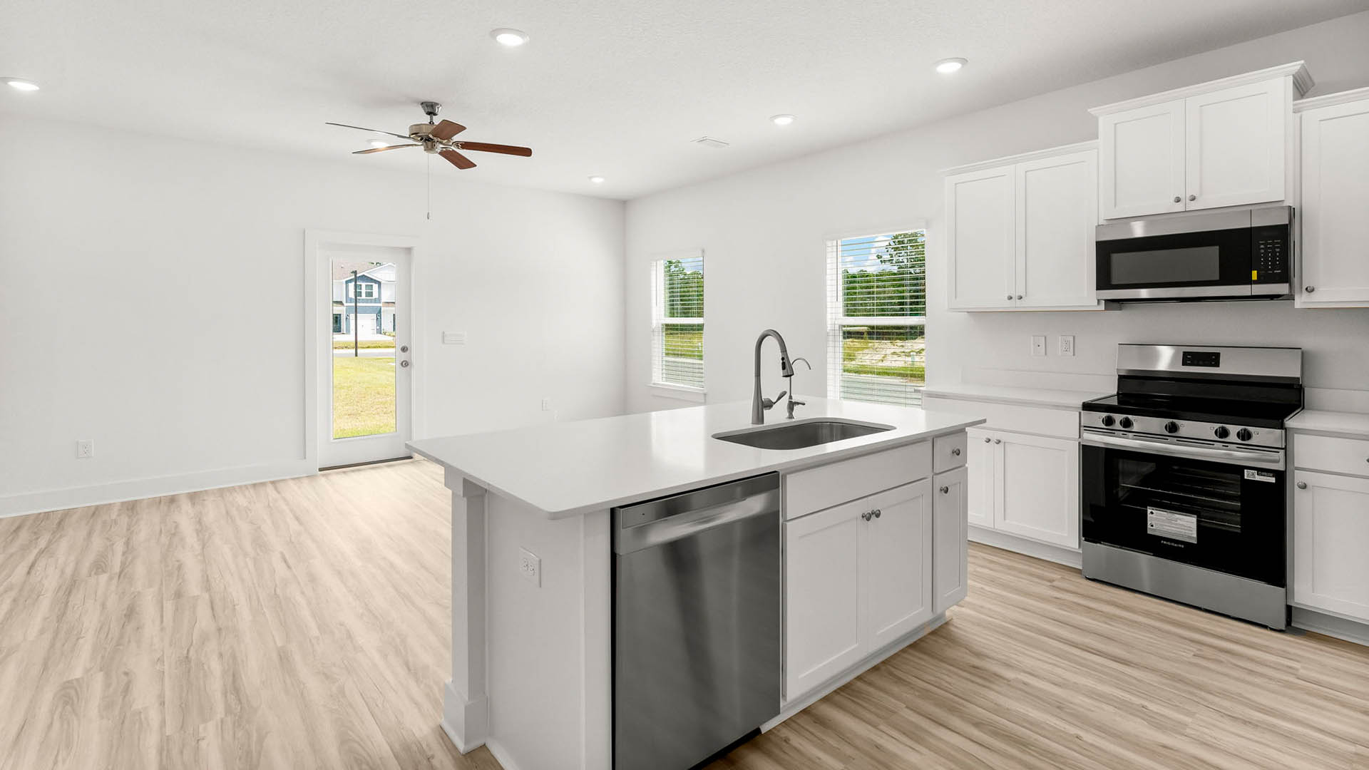 The kitchen is open to the living and dining areas