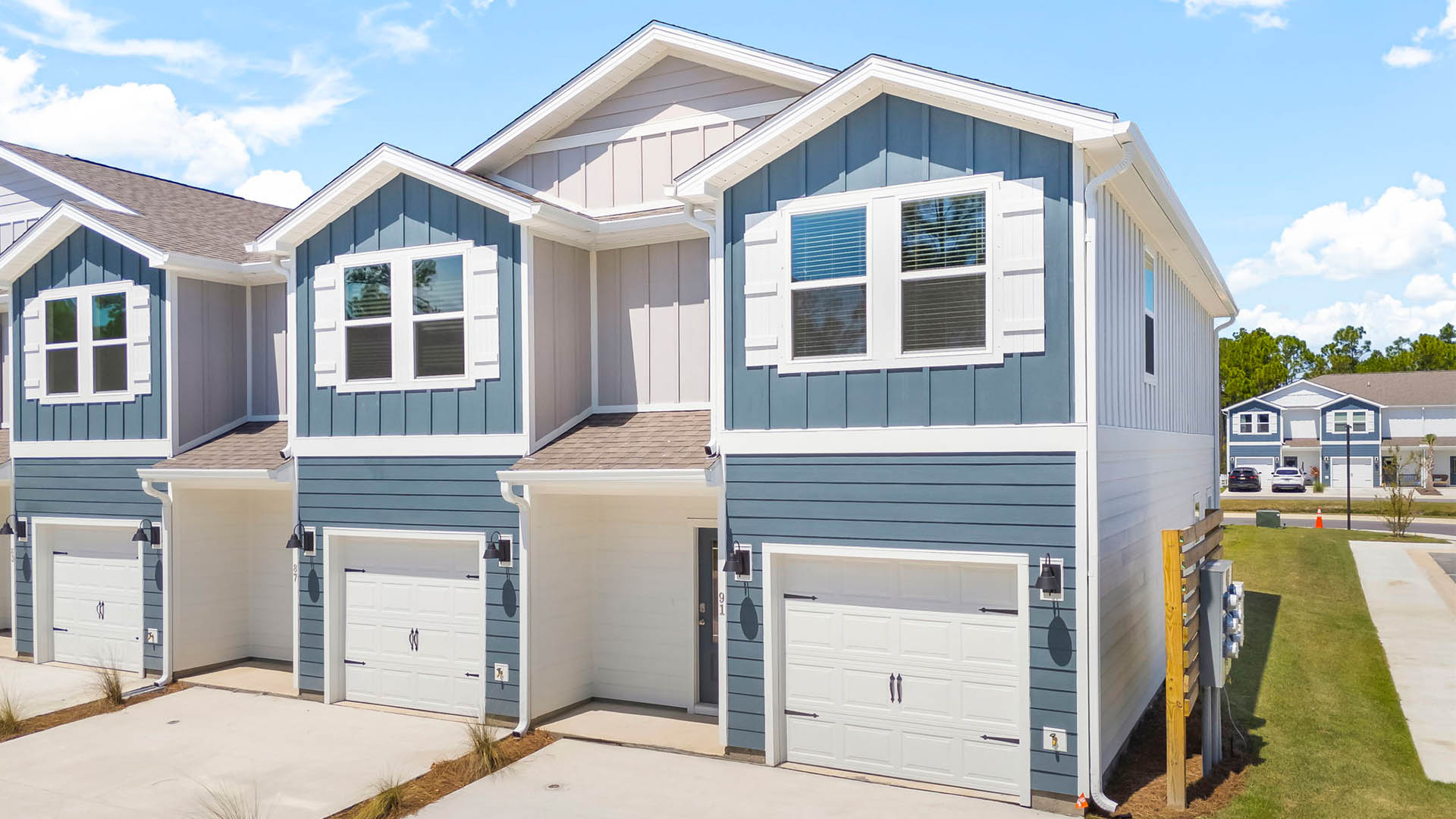 The exterior of this townhome has Hardie siding and a covered front entry