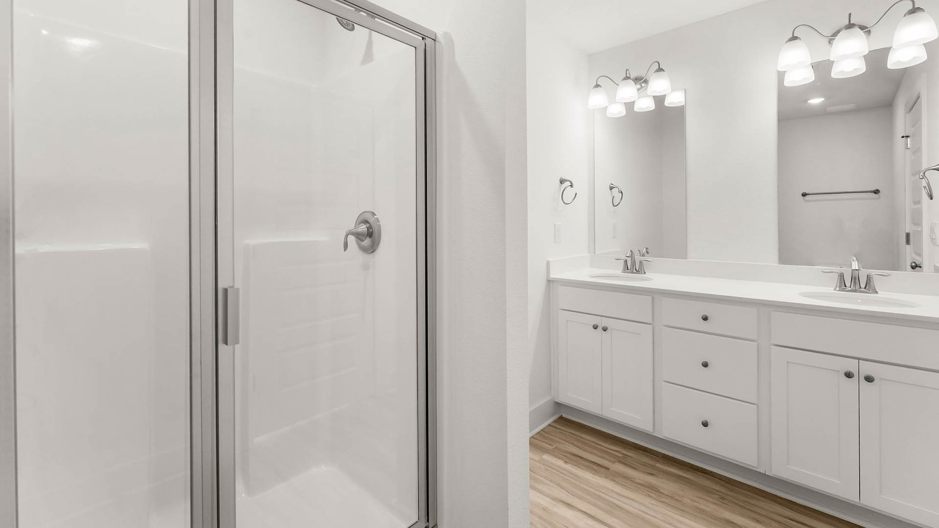 The primary bathroom has a linen storage area next to the shower