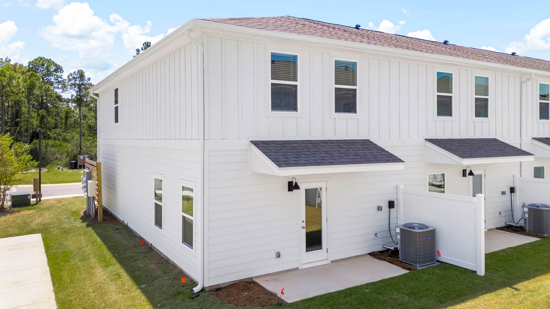 The back of the Palm townhome has a patio and partition between the units