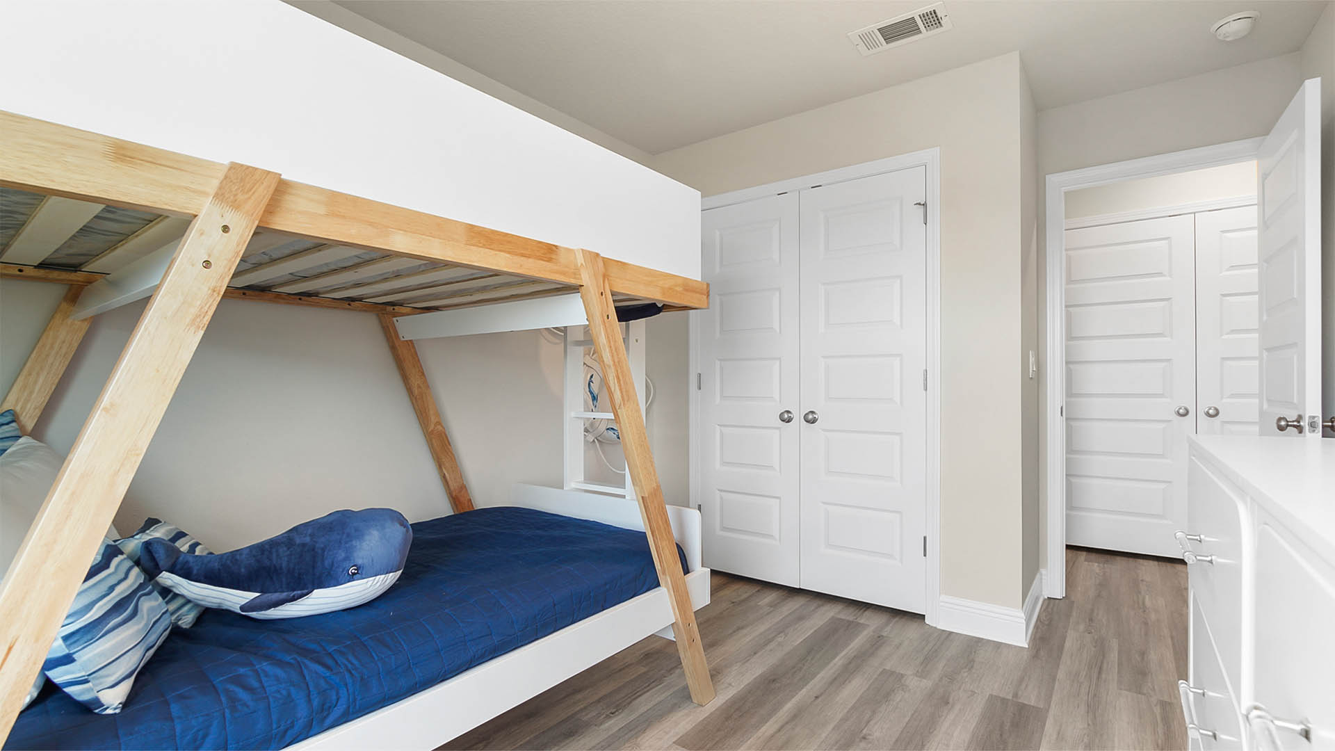 Bedroom two with EVP flooring and closet.