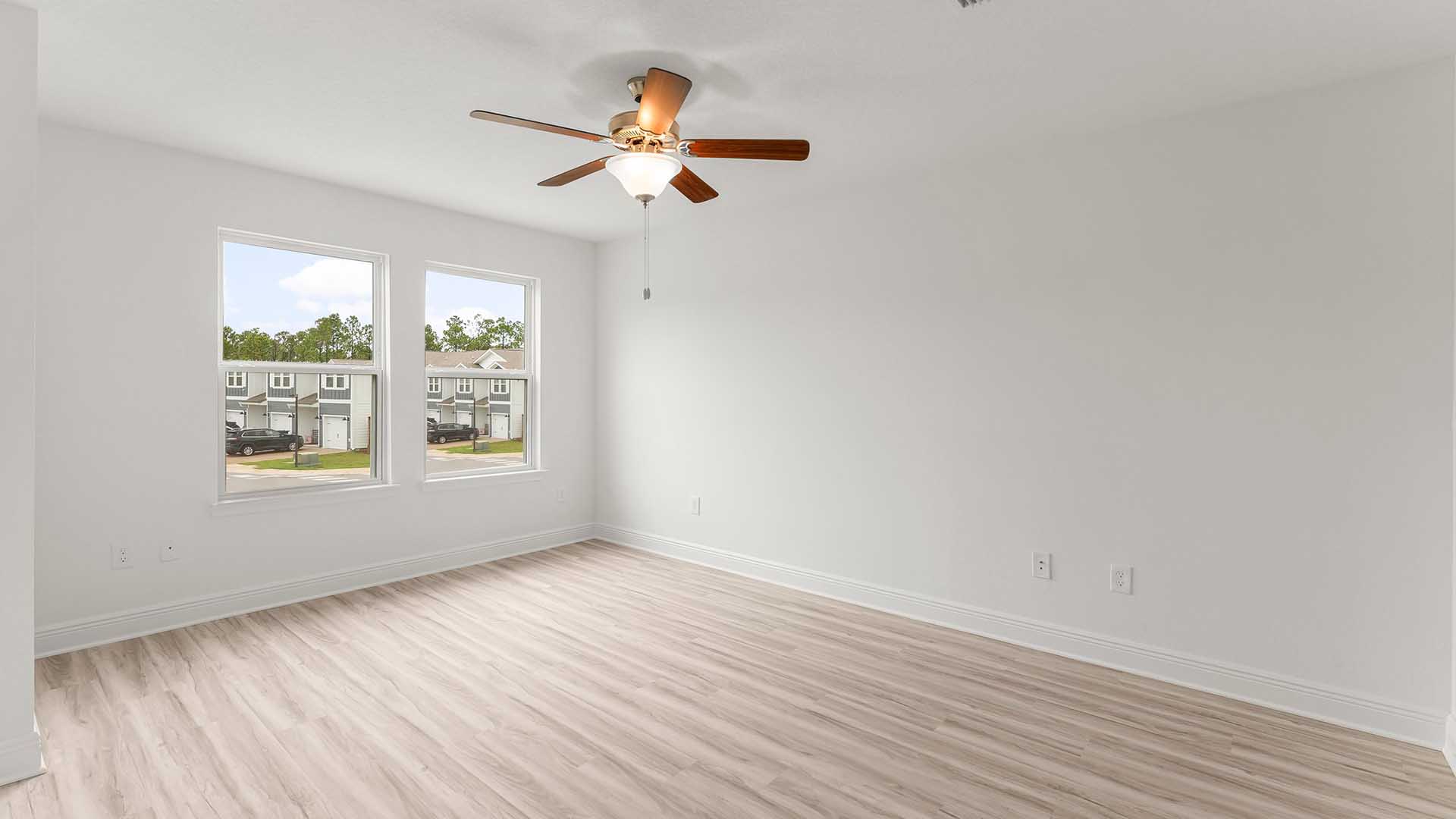 The primary bedroom is spacious and has EVP flooring
