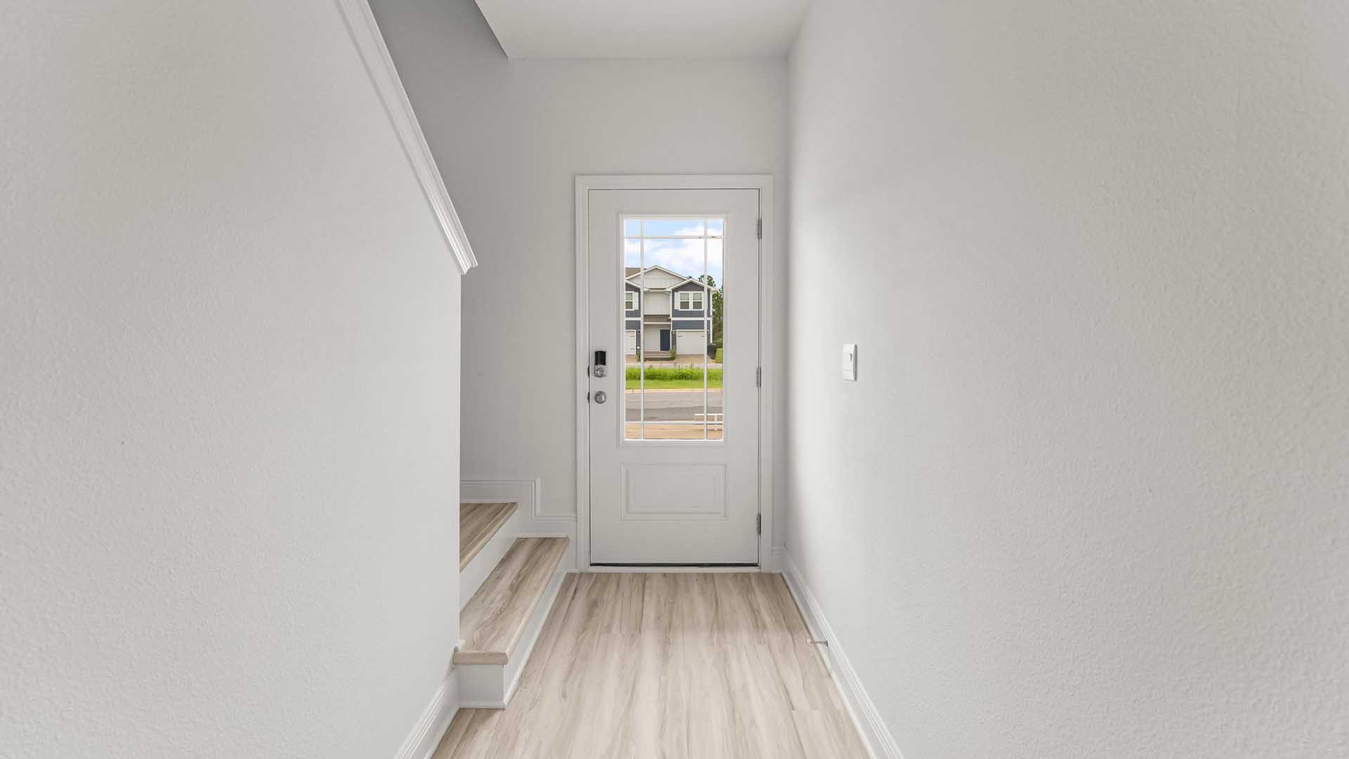 The entry hall has stairs that lead to the second level where you will find all bedrooms and the laundry area