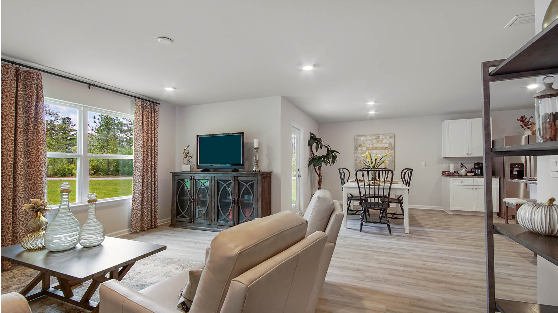 Living room adorned with windows allowing for natural light