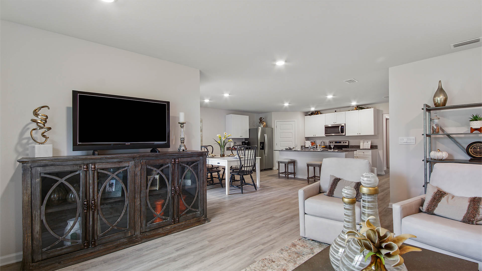 The living room is spacious and is open to the kitchen