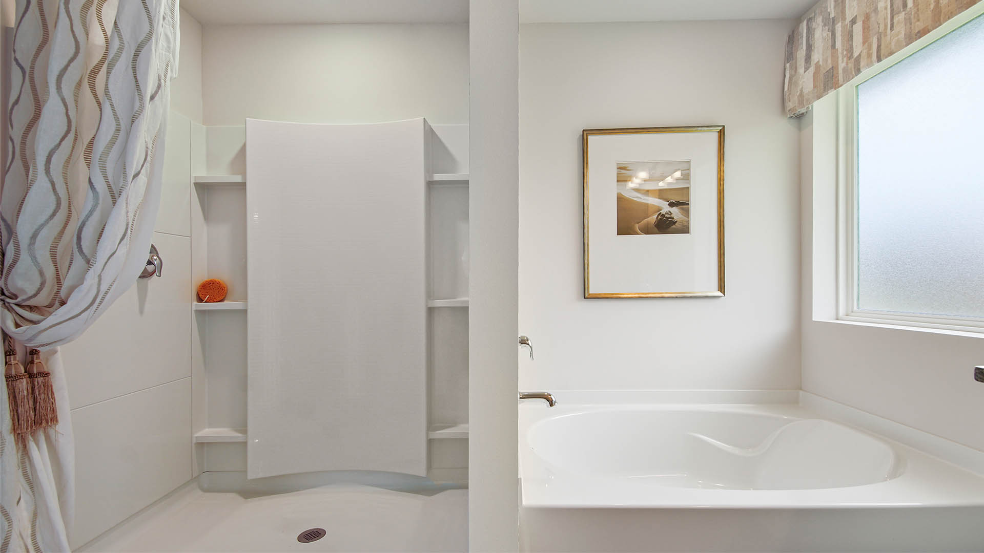 Separate shower and large soak tub in the primary bathroom