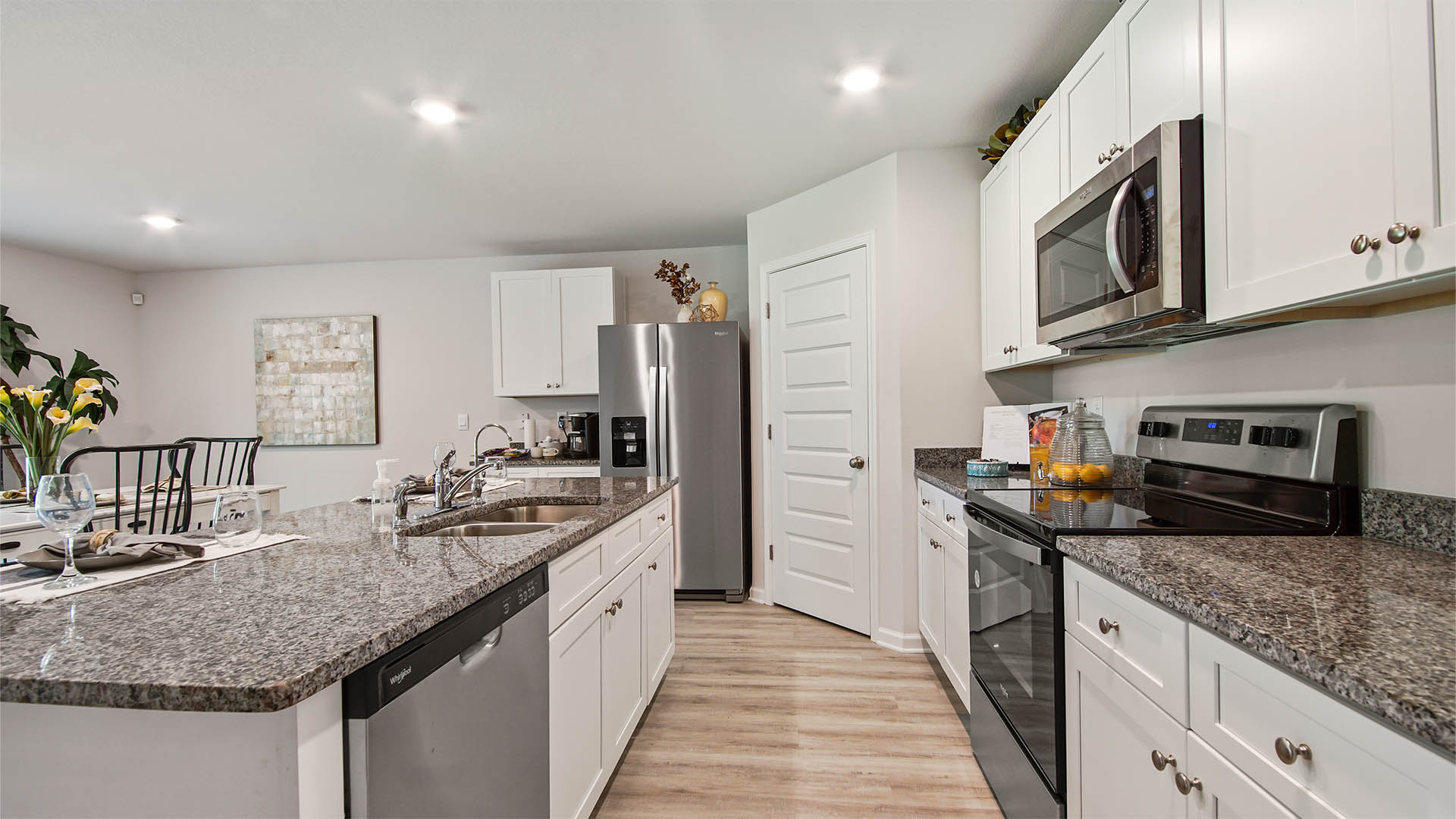 Center island in kitchen and beautiful white cabinetry