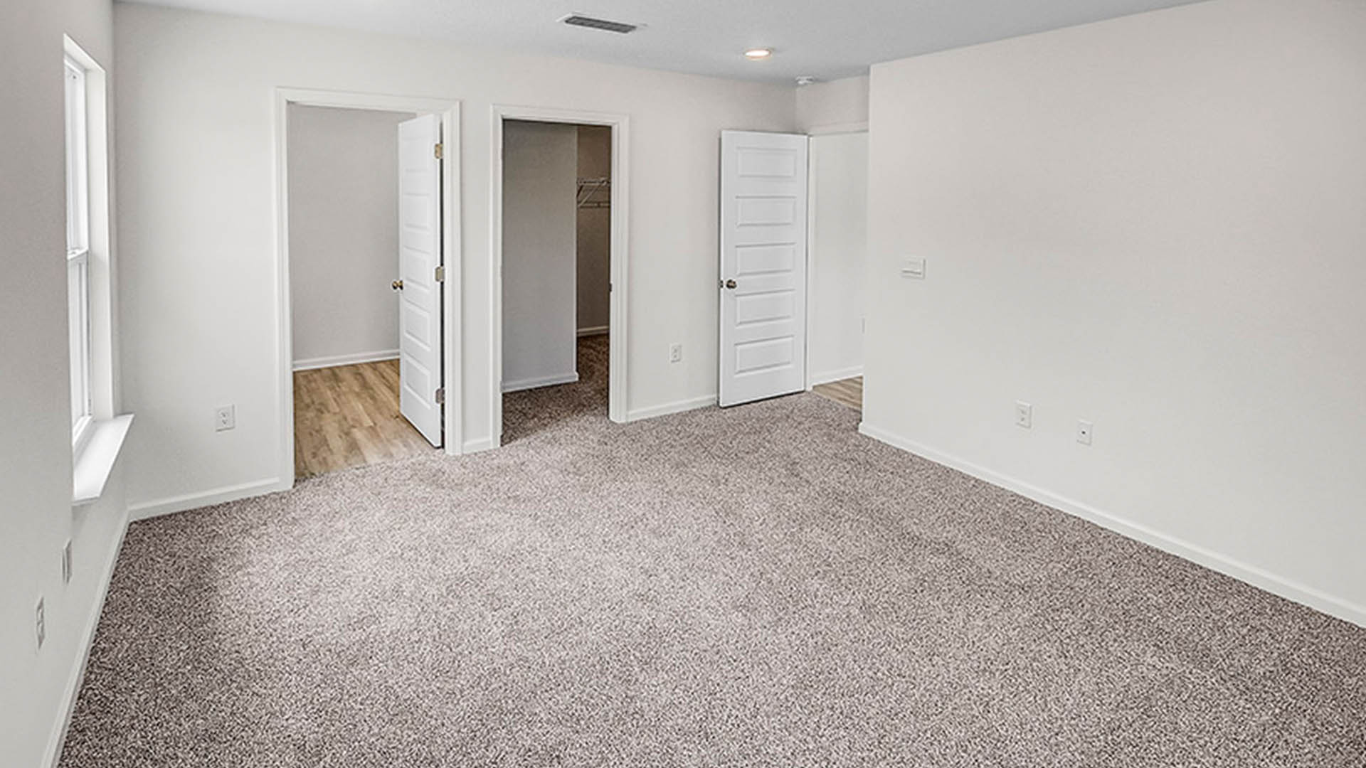 The primary bedroom features a large ensuite