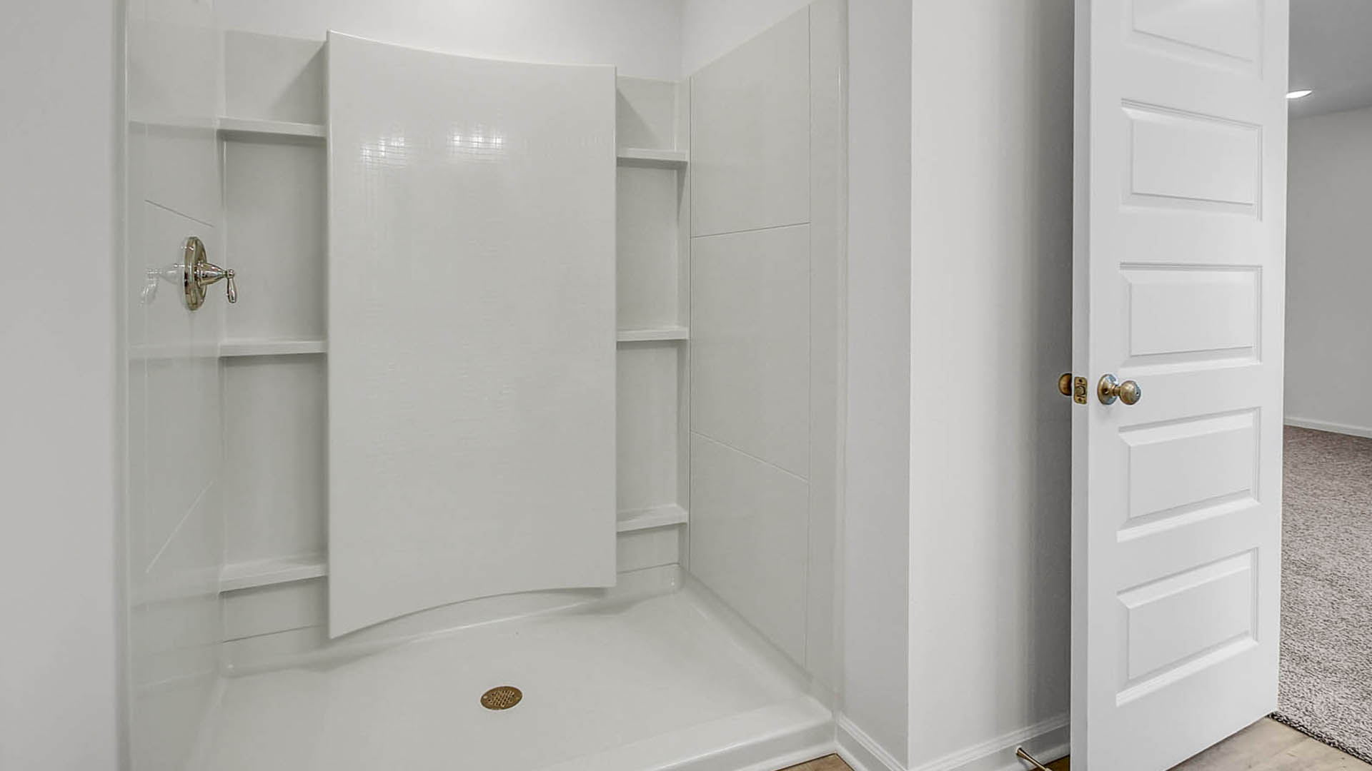 The primary bathroom features an oversize shower as well as a large walk-in closet