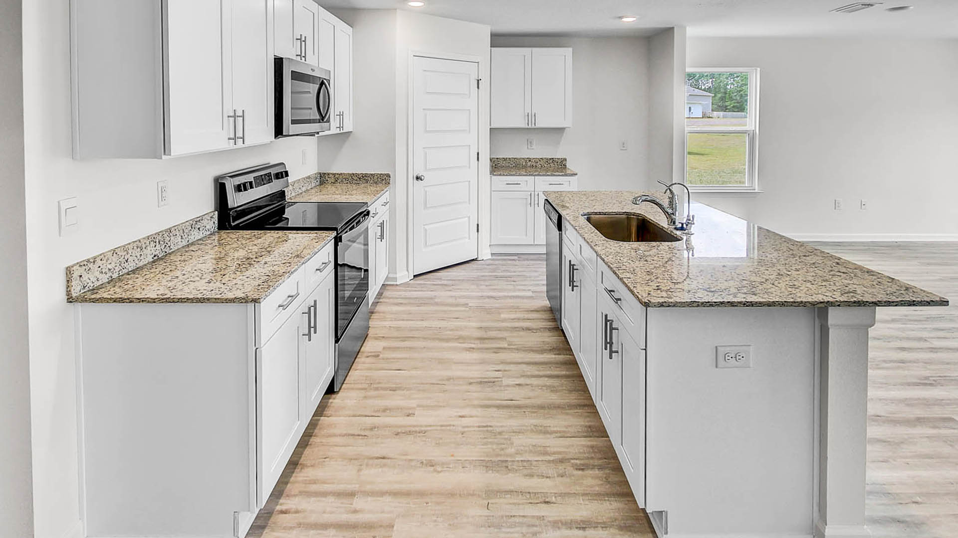Beautiful white cabinetry contributes to the bright feel of the living space
